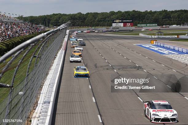 Harrison Burton, driver of the DEX Imaging Toyota, leads the field during the NASCAR Xfinity Series Pocono Green 225 Recycled by J.P. Mascaro & Sons...