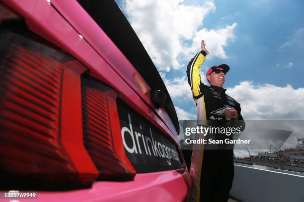 Ryan Sieg, driver of the CMR Construction and Roofing/A-Game Ford, waves to fans on the grid prior tothe NASCAR Xfinity Series Pocono Green 225...