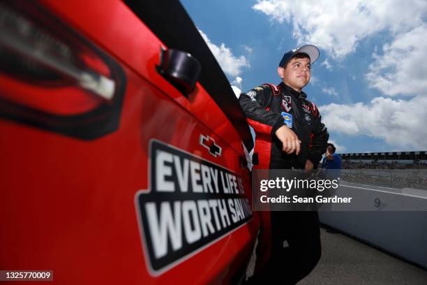 Ryan Vargas, driver of the Every Life is Worth Saving Chevrolet, waits on the grid prior to the NASCAR Xfinity Series Pocono Green 225 Recycled by...