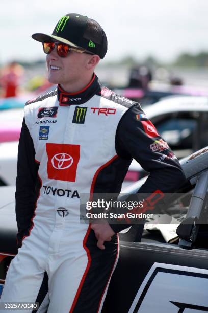 Ty Gibbs, driver of the Joe Gibbs Racing Toyota, waits on the grid prior to the NASCAR Xfinity Series Pocono Green 225 Recycled by J.P. Mascaro &...