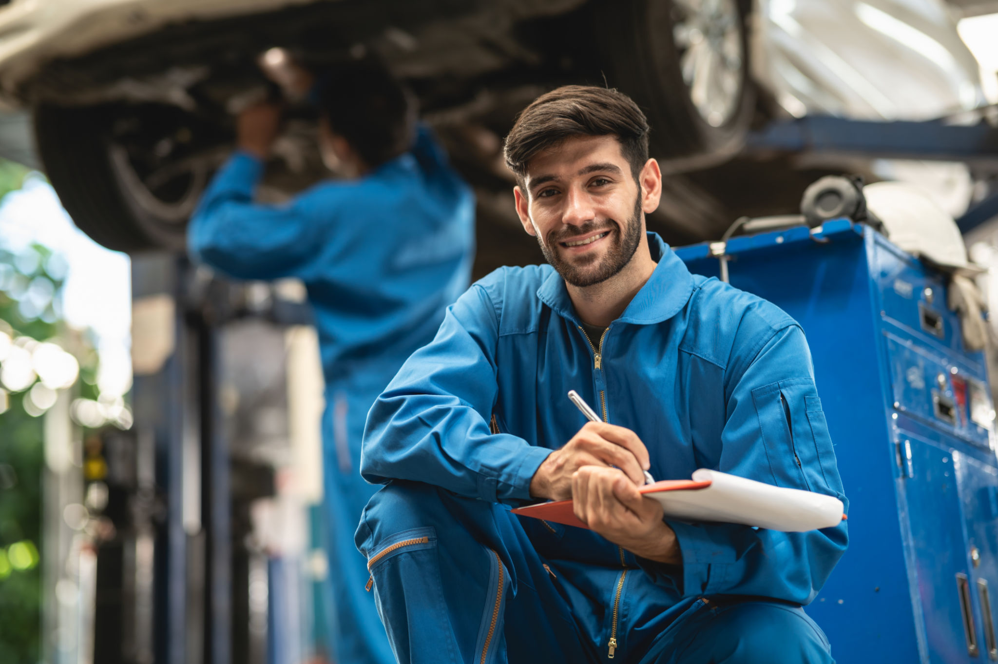 mechanic inspecting car