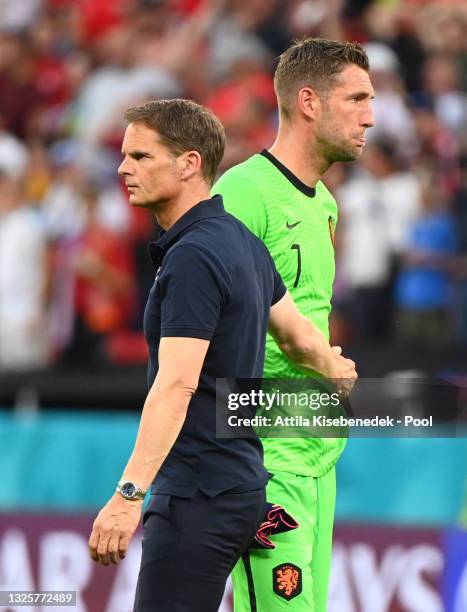 Maarten Stekelenburg of Netherlands looks dejected as he is consoled by Frank de Boer, Head Coach of Netherlands after the UEFA Euro 2020...