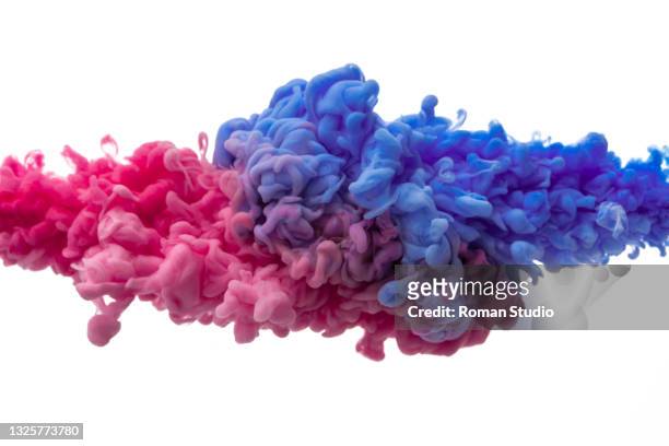 paint splash. colorful ink swirling in water. abstract background - farbklecks freisteller stock-fotos und bilder