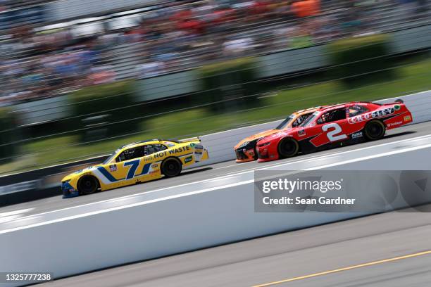 Justin Allgaier, driver of the Hellmann's 100% Recycled Chevrolet, and Myatt Snider, driver of the Crosley Furniture Chevrolet, race during the...