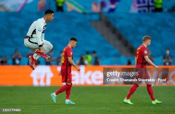 Cristiano Ronaldo of Portugal jumps as he leads the team out prior to the UEFA Euro 2020 Championship Round of 16 match between Belgium and Portugal...