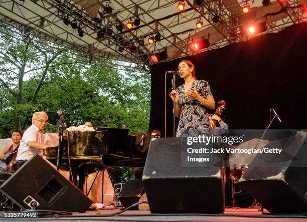 American musicians Thomas Lauderdale on piano and singer China Forbes perform with the Portland, Oregon-based pop/rock band Pink Martini at a benefit...