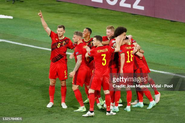 Thorgan Hazard of Belgium celebrates with team mates after scoring their side's first goal during the UEFA Euro 2020 Championship Round of 16 match...