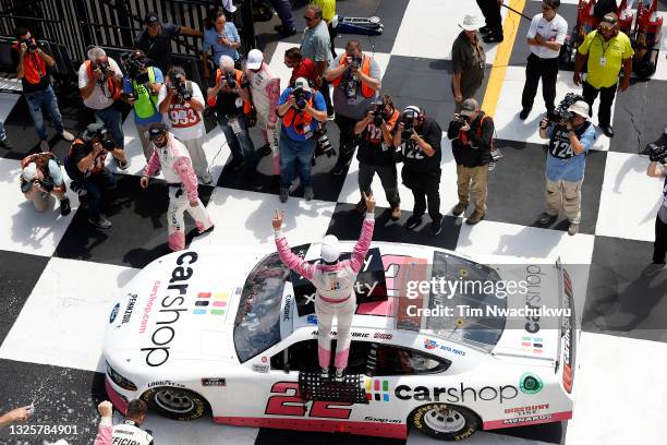 Austin Cindric, driver of the Car Shop Ford, celebrates in victory lane after winning the NASCAR Xfinity Series Pocono Green 225 Recycled by J.P....