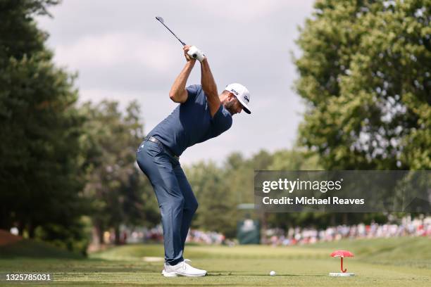 Dustin Johnson of the United States plays his shot from the eighth tee during the final round of the Travelers Championship at TPC River Highlands on...