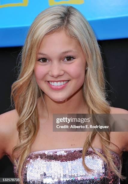 Actress Olivia Holt arrives at Walt Disney Pictures Presents The Premiere Of "PROM" at El Capitan Theatre on April 21, 2011 in Los Angeles,...