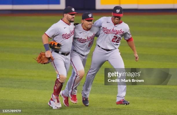 Kyle Schwarber, Gerardo Parra, and Juan Soto of the Washington Nationals celebrate their 5-1 win against the Miami Marlins at loanDepot park on June...