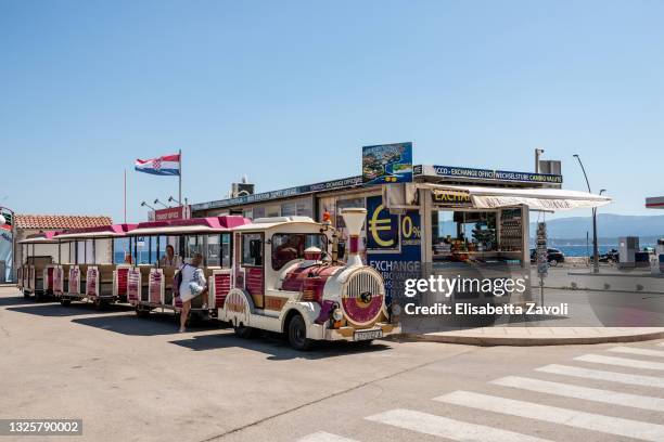 Some tourists get on a road train to visit the town on June 27, 2021 in Bol, Croatia. Croatia has already reported a 40 percent increase in tourists...