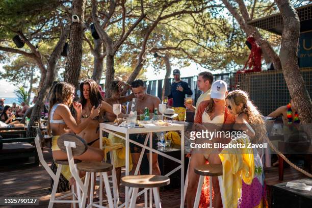 Group of tourists from USA, mostly from Miami, celebrates the 41st birthday party of Kenneth Baboun at Auro Bar in Zlatni Rat beach on June 27, 2021...