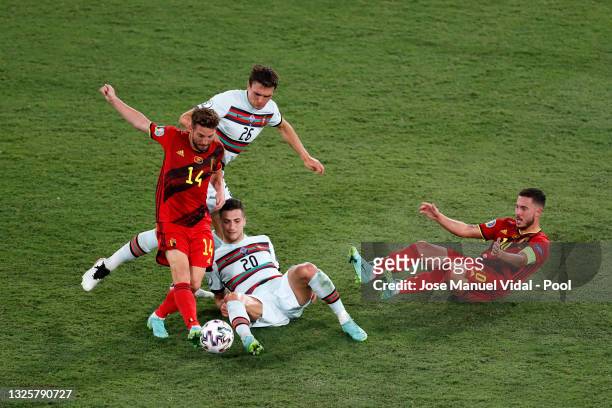 Dries Mertens of Belgium is challenged by Diogo Dalot and Joao Palhinha of Portugal as Eden Hazard of Belgium reacts during the UEFA Euro 2020...