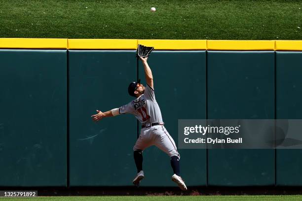 Ender Inciarte of the Atlanta Braves catches a fly ball in the sixth inning against the Cincinnati Reds at Great American Ball Park on June 27, 2021...