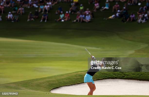 Nelly Korda plays her shot on the 14th hole the final round of the KPMG Women's PGA Championship at Atlanta Athletic Club on June 27, 2021 in Johns...