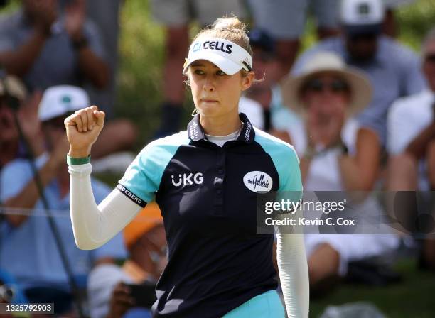 Nelly Korda reacts to her birdie putt on the 14th hole the final round of the KPMG Women's PGA Championship at Atlanta Athletic Club on June 27, 2021...