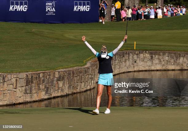 Nelly Korda reacts after putting in to win on the 18th green during the final round of the KPMG Women's PGA Championship at Atlanta Athletic Club on...