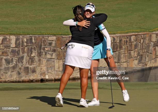 Nelly Korda reacts with Lizette Salas after putting in to win on the 18th green during the final round of the KPMG Women's PGA Championship at...