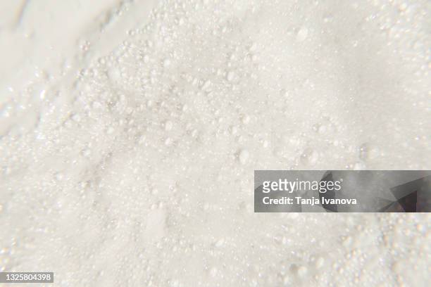 liquid textured white facial foam creamy bubble soap background. - texture mousse stock pictures, royalty-free photos & images
