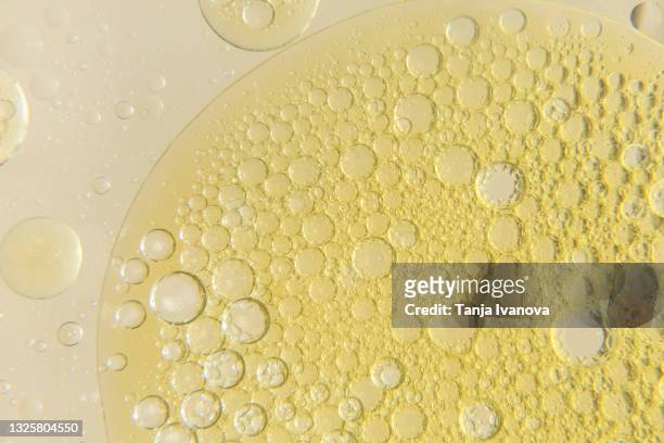 abstract background of colorful oil drops in water - oil macro stock pictures, royalty-free photos & images