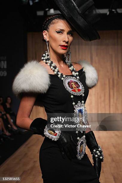 Model walks the runway wearing Gustavo Helguera jewelry and accessories Autumn/Winter 2009 during Mercedes-Benz Fashion Mexico 2009 at Antara Polanco...