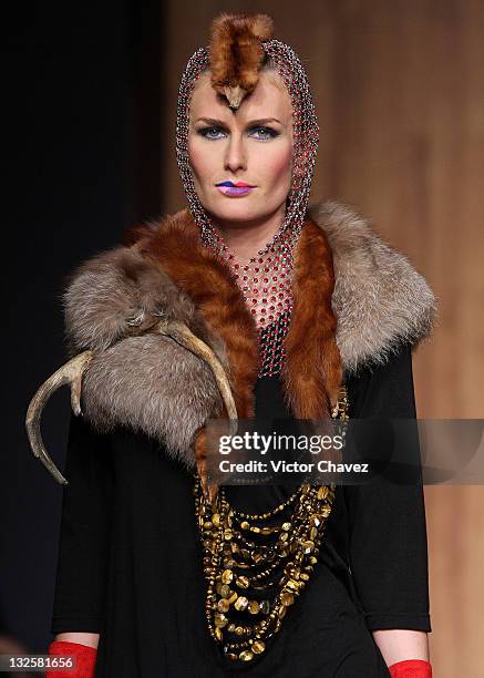 Model walks the runway wearing Gustavo Helguera jewelry and accessories Autumn/Winter 2009 during Mercedes-Benz Fashion Mexico 2009 at Antara Polanco...