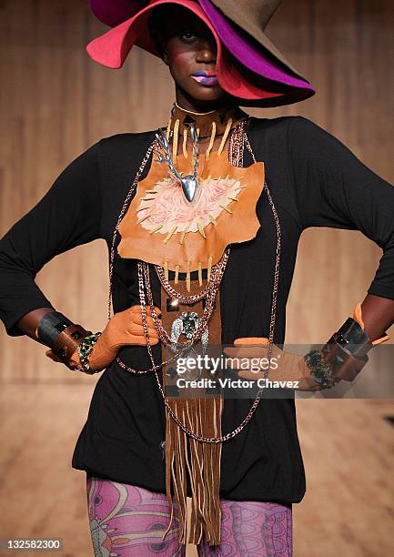 Model walks the runway wearing Gustavo Helguera jewelry and accessories Autumn/Winter 2009 during Mercedes-Benz Fashion Mexico 2009 at Antara Polanco...
