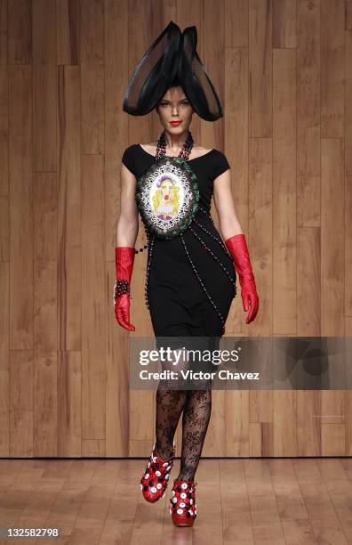 Model walks the runway wearing Gustavo Helguera jewelry and accessories Autumn/Winter 2009 during Mercedes-Benz Fashion Mexico 2009 at Antara Polanco...