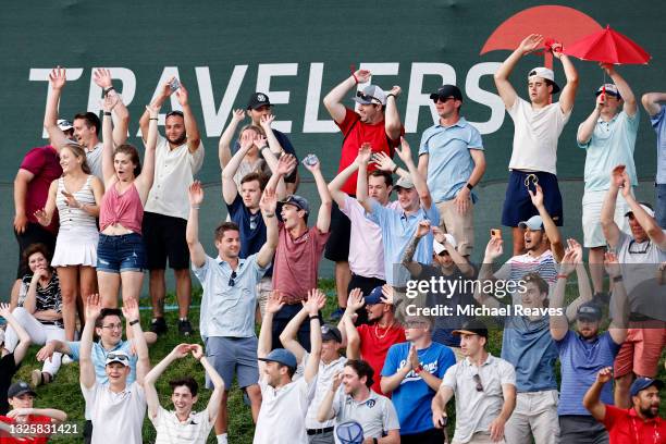 Fans do the wave during the seventh playoff hole between Kramer Hickok of the United States and Harris English of the United States during the final...