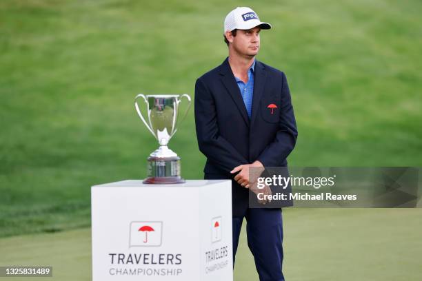 Harris English of the United States smiles during the trophy presentation after winning the Travelers Championship on the eighth playoff hole against...