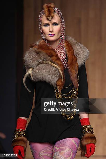 Model walks the runway wearing Gustavo Helguera jewelry and accessories Autumn/Winter 2009 during Mercedes-Benz Fashion Mexico 2009 at Antara Polanco...