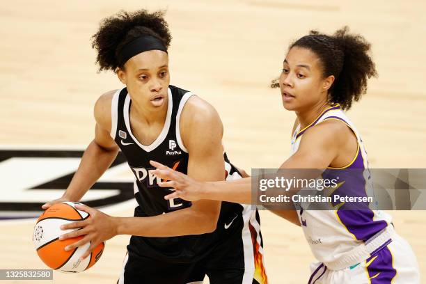 Megan Walker of the Phoenix Mercury looks to pass against Nia Coffey of the Los Angeles Sparks during the second half of the WNBA game at Phoenix...