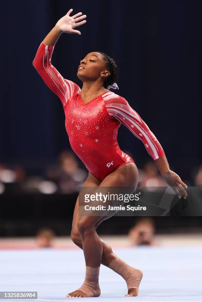 Simone Biles competes on the floor exercise during the Women's competition of the 2021 U.S. Gymnastics Olympic Trials at America’s Center on June 27,...