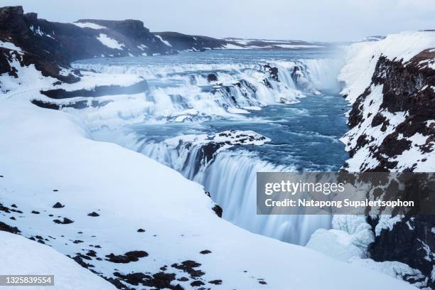 gullfoss waterfall during winter, iceland. - gullfoss falls stock-fotos und bilder