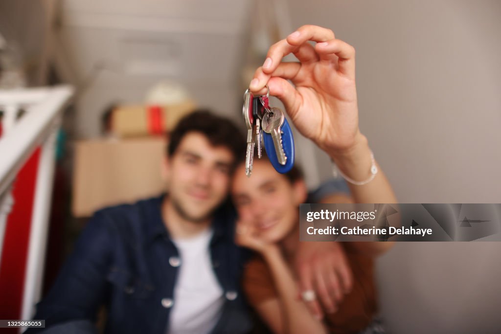 A happy young couple moving into a new apartment