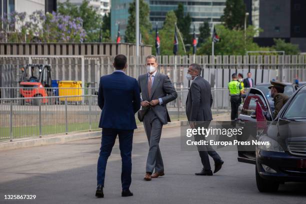 Prime Minister Pedro Sanchez receives King Felipe VI as they arrive for day one of the 14th edition of the Mobile World Congress at the Gran Via...