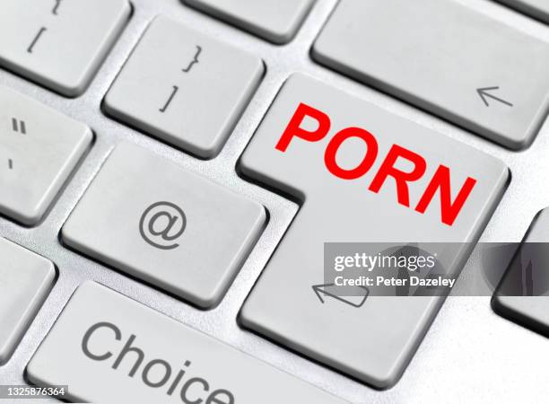 online porn choice on keyboard - sleaze stock pictures, royalty-free photos & images