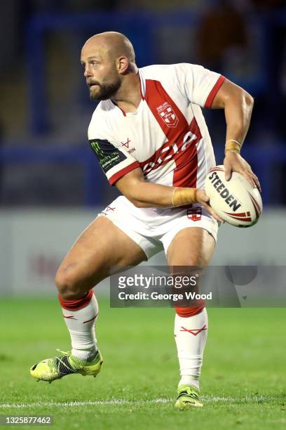 Paul McShane of England passes the ball during the Rugby League International match between England and Combined Nations All Stars at The Halliwell...