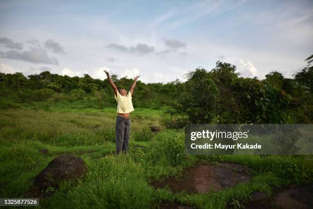 girl playing outdoors in nature - monsoon stock pictures, royalty-free photos & images