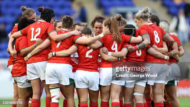 Players of Wales form a huddle following defeat in the Rugby League International match between England Women and Wales Women at The Halliwell Jones...