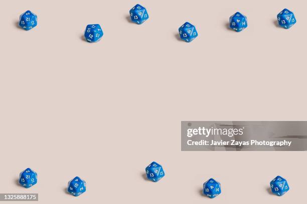 some 20 sided role playing game dices on pastel background - rollenspiel stock-fotos und bilder