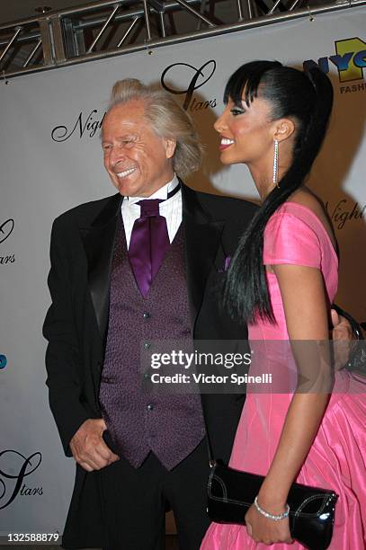 Peter Nygard and Eve during 17th Annual Night of 100 Stars Gala- Arrivals at Beverly Hills Hotel in Beverly Hills, California, United States.