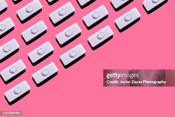 arrangement of some light switches on pink background - toggle switch stock pictures, royalty-free photos & images
