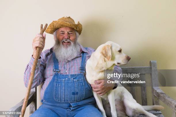 old man with his beloved dog - senior man grey long hair stock pictures, royalty-free photos & images