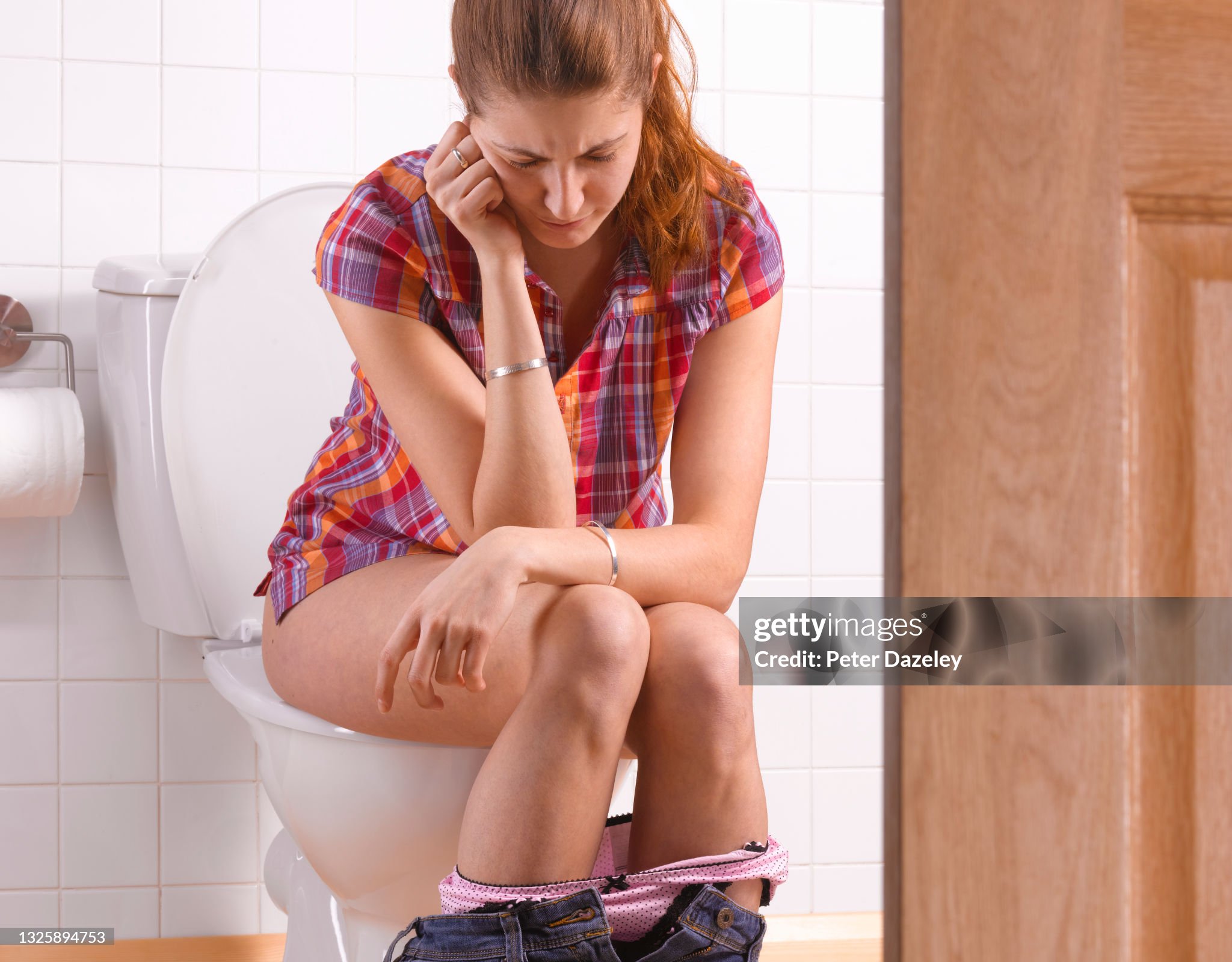 woman-in-pain-sitting-on-the-toilet.jpg