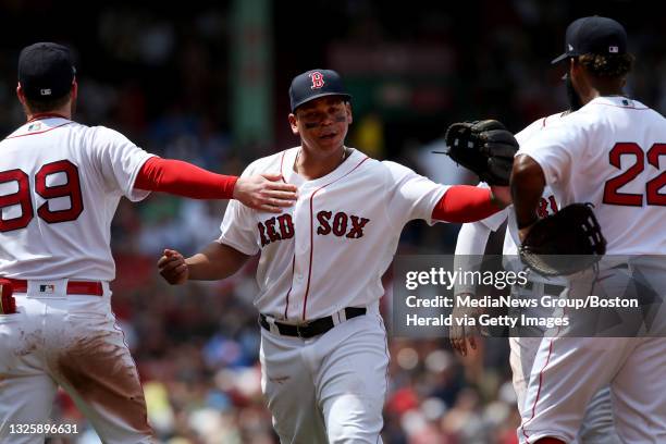 Boston Red Sox's Alex Verdugo, Rafael Devers and Danny Santana react after an under review play went the Sox way during the 4th inning of the game...