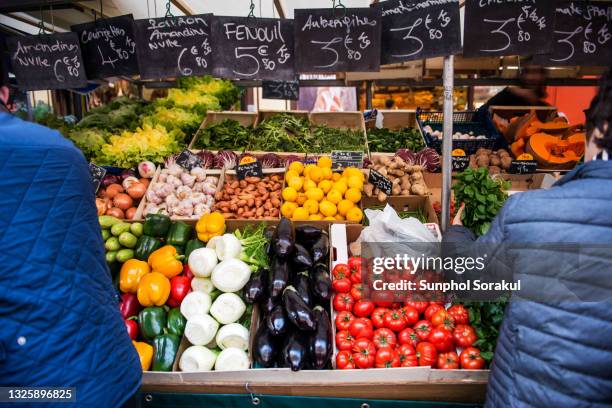 fresh fruits and vegetable stall at saturday outdoor street market at place d'algre. paris france - food stall bildbanksfoton och bilder