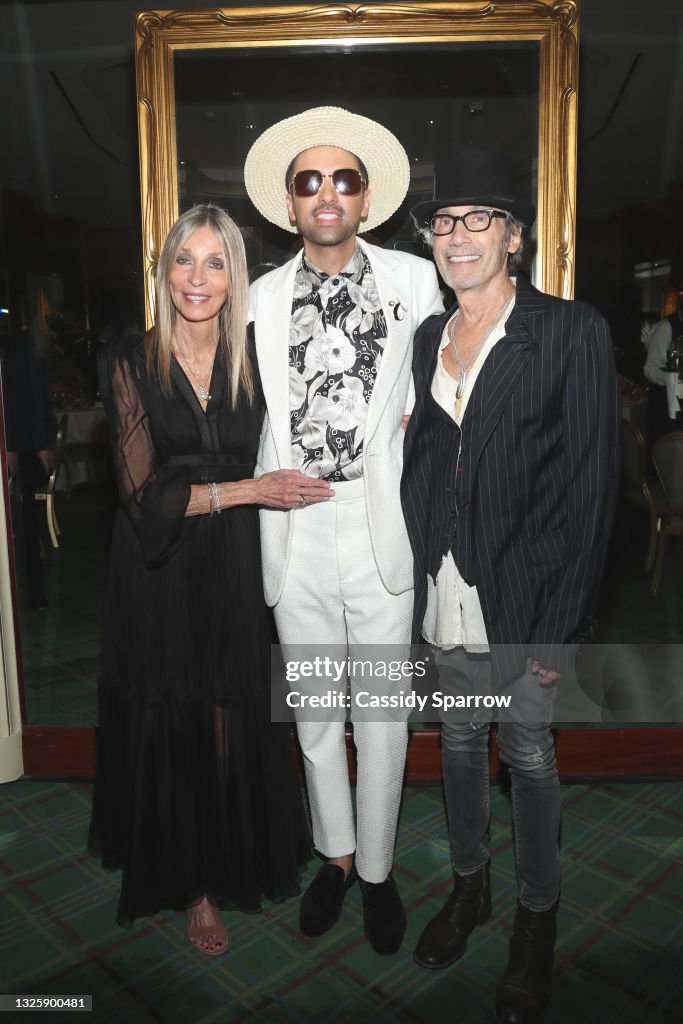 DJ Cassidy poses with his mother Monica and father Johnny at DJ... News