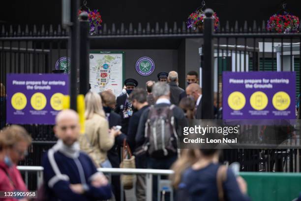 Security teams process the tennis fans as they enter the Wimbledon All England Tennis Club on day one of the Wimbledon tennis championships on June...